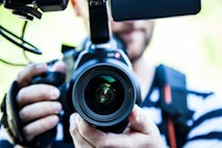 a man holding a video camera